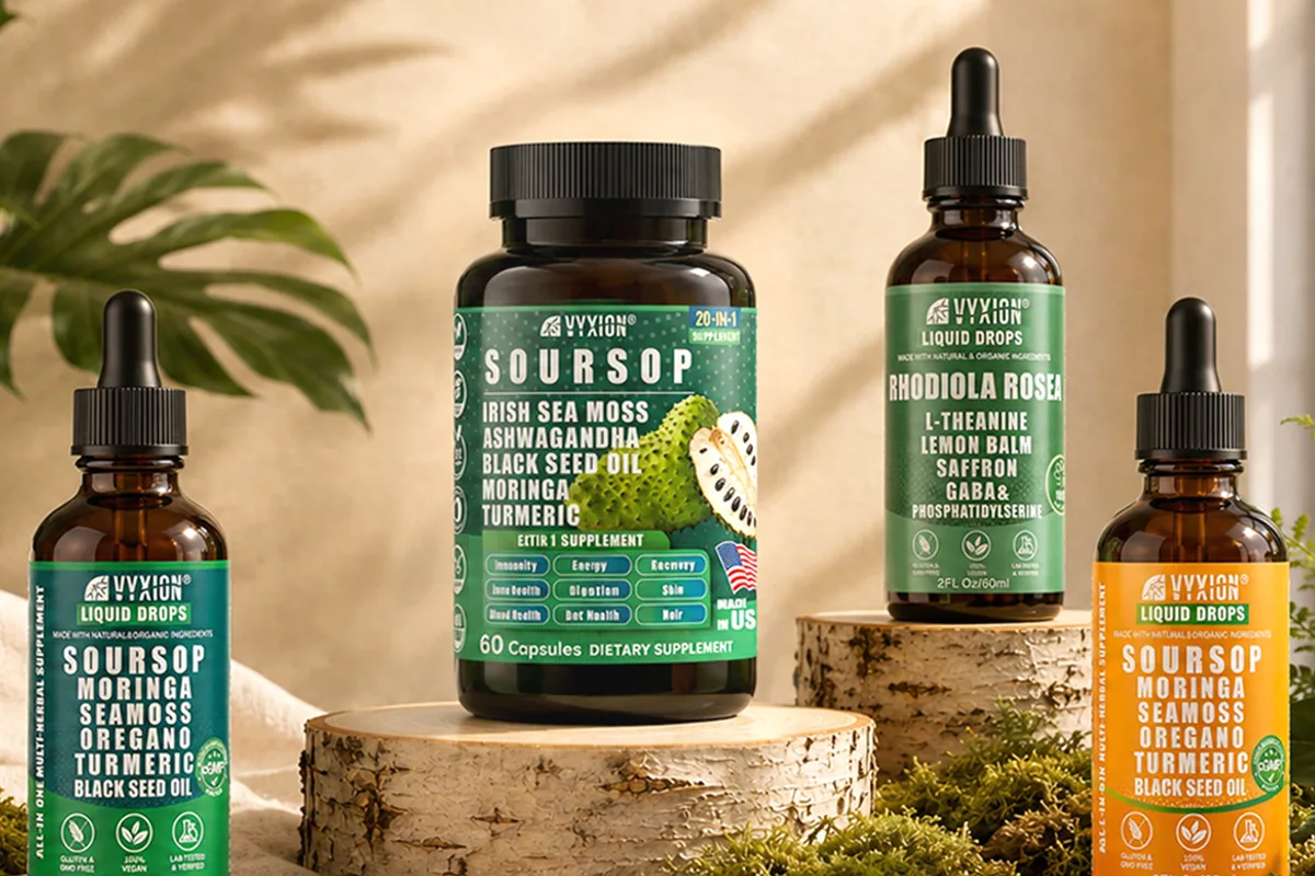 Four Vyxion bottles on birch slices: soursop drops, soursop capsules, rhodiola drops and orange soursop drops